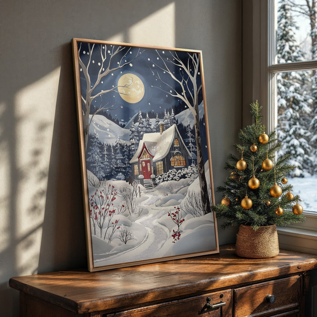 Framed Wall Art featuring a cozy winter cabin scene in a cool blue and white palette, perfect for adding a touch of holiday cheer to your home.