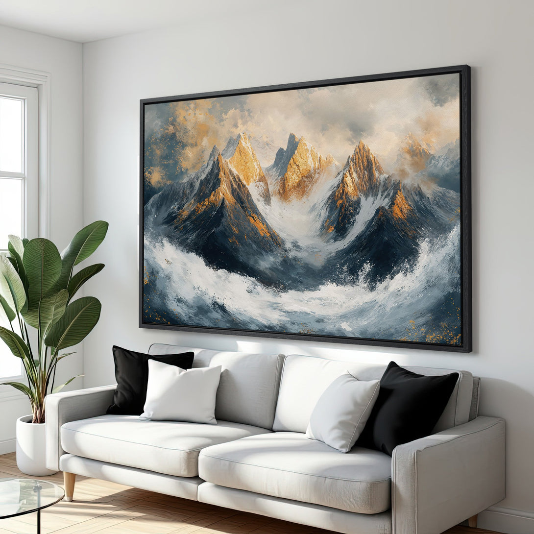 Framed Wall Art: Abstract mountain landscape Canvas Print in a modern living room. Features a moody blue, gold, and white color palette. Elevate your space!