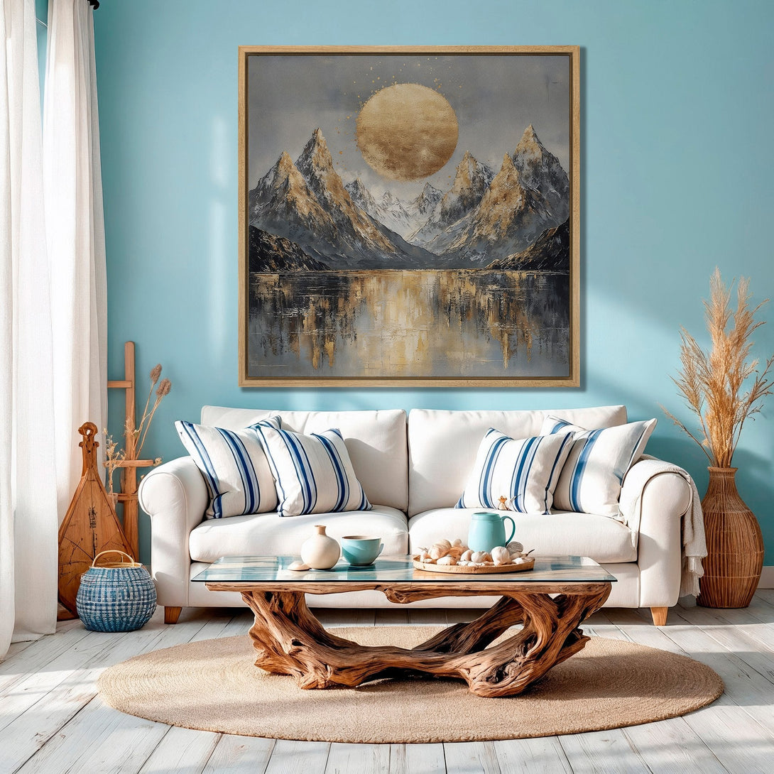 Framed Wall Art: Mountain landscape canvas print in gold and gray tones, displayed in a living room with a blue wall. Modern home decor inspiration.