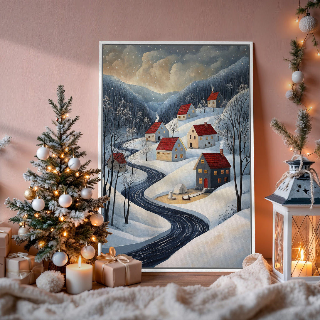 Framed Wall Art: Winter village scene in blue, white, and red. Cozy, whimsical style perfect for holiday decor. Add warmth to your home!
