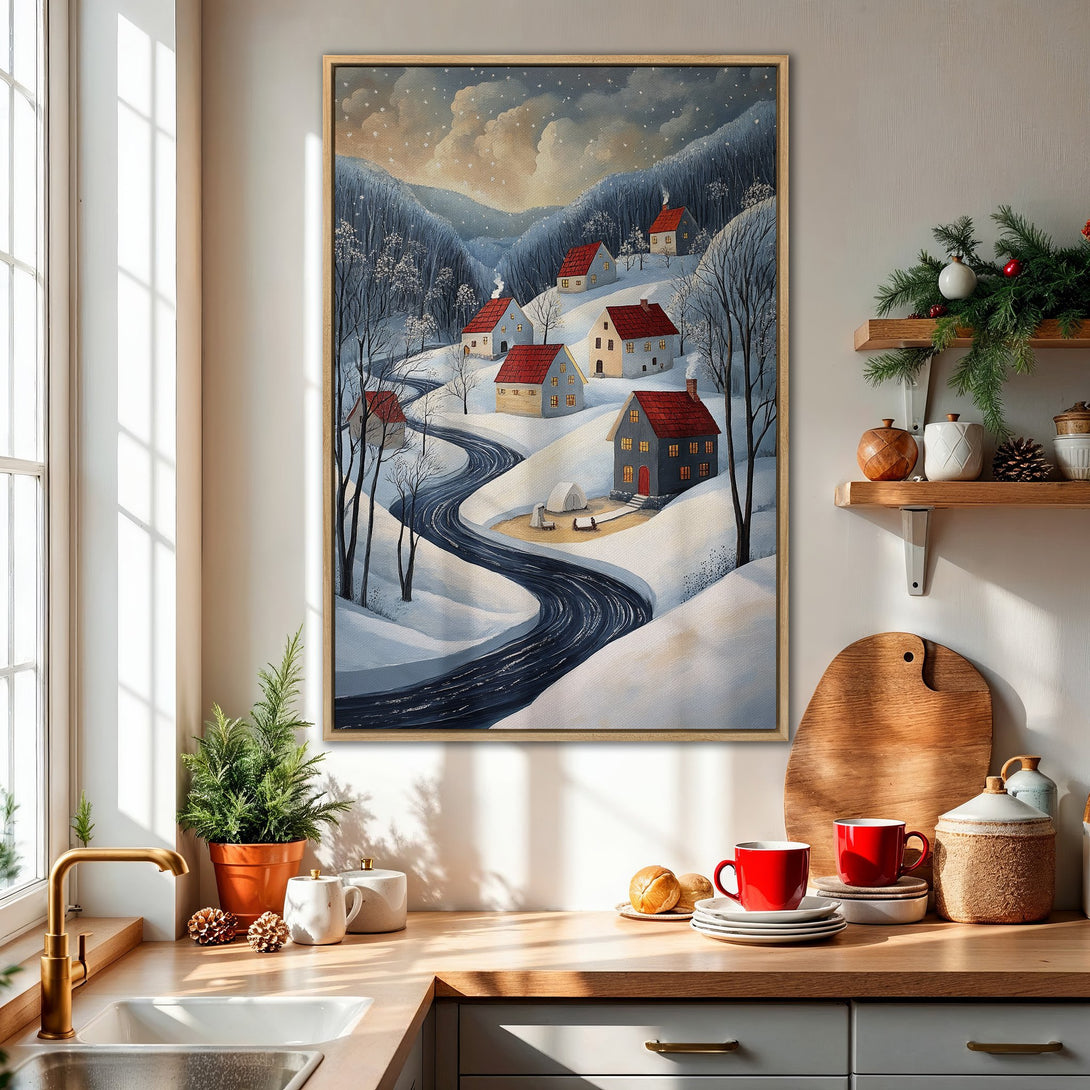 Framed Wall Art: Winter village scene with snow-covered landscape, houses, and a winding road. Features a cool blue and white color palette, perfect for cozy decor.