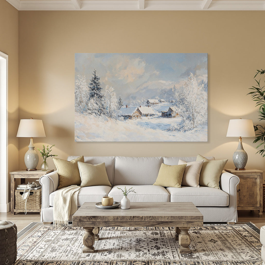 Framed Wall Art: Winter landscape canvas print with snow-covered cabins, trees, and a serene blue and white color palette. Perfect for cozy home decor!