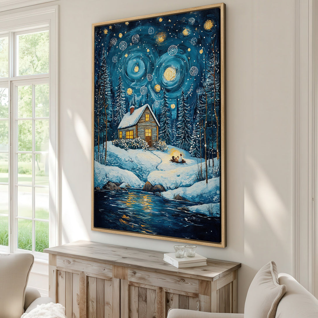 Framed Wall Art of a cozy winter cabin scene, painted in a whimsical style with a blue and gold color palette. Perfect for home decor.