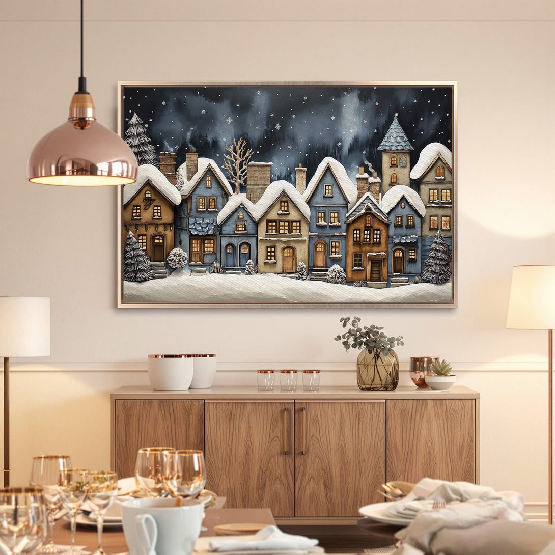 Framed Wall Art: Charming winter village scene in blue, brown, and white. Perfect for cozy home decor. Bring the magic of winter indoors!