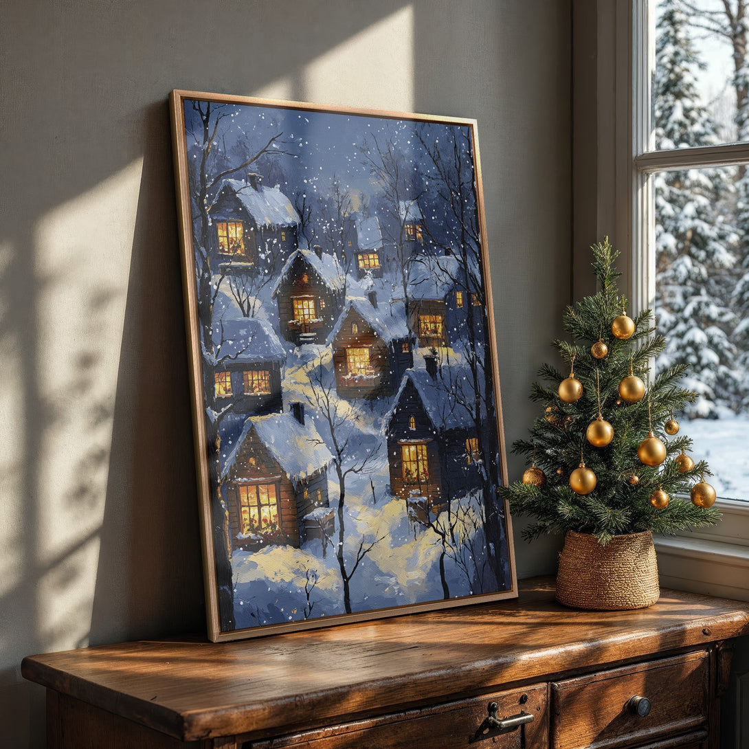 Framed Wall Art: Winter village scene in blue and gold tones. Cozy cottage painting adds warmth and charm to any space. Perfect for holiday decor!