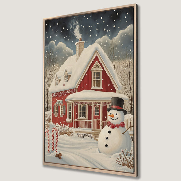 Framed Wall Art: Winter scene with a red house, snowman, and falling snow. Cozy, festive art in a warm color palette. Perfect holiday decor!