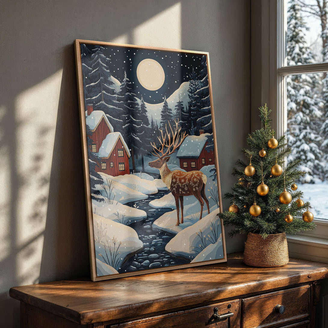 Framed Wall Art: Winter landscape Canvas Print with a deer, cabins, and snowy scene. Features a blue, brown, and red color palette. Perfect for cozy decor.