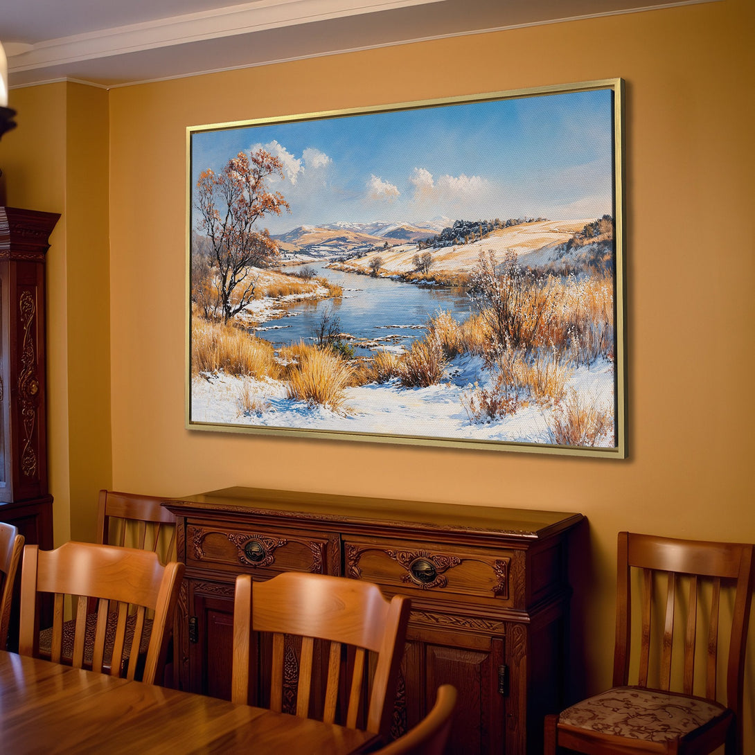 Canvas Print of a winter landscape painting in a warm-toned living room. Features a river scene with blue, white, and gold hues.