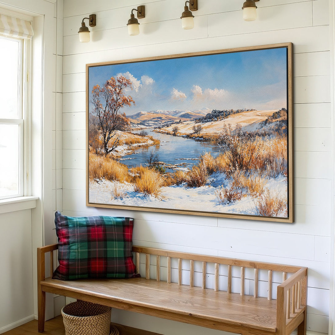 Framed Wall Art: Winter landscape Canvas Print in a rustic interior. Features a serene river scene with blue, white, and golden hues. Perfect for home decor.