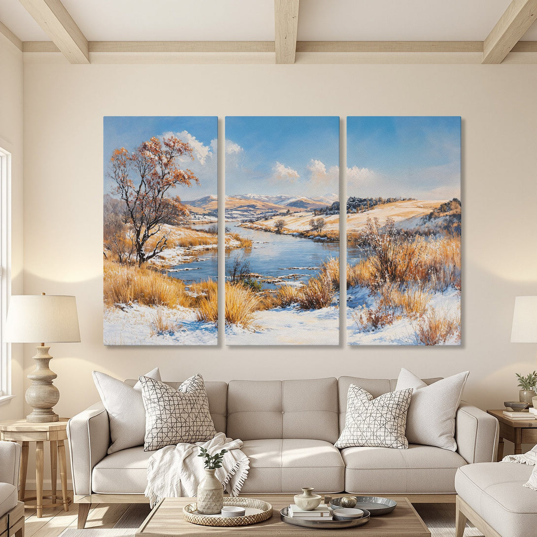 Canvas Print of a winter landscape painting in a warm, neutral interior. Features a river scene with blue, gold, and white hues. Perfect wall art decor.