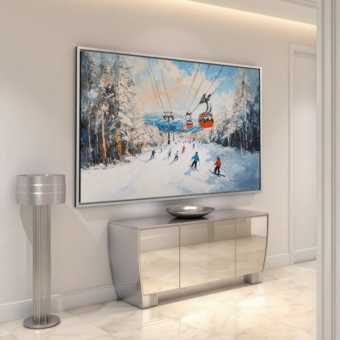 Framed Wall Art: Winter ski scene canvas print in a modern interior. Features skiers, orange gondolas, and a cool blue & white palette. Perfect for home decor!