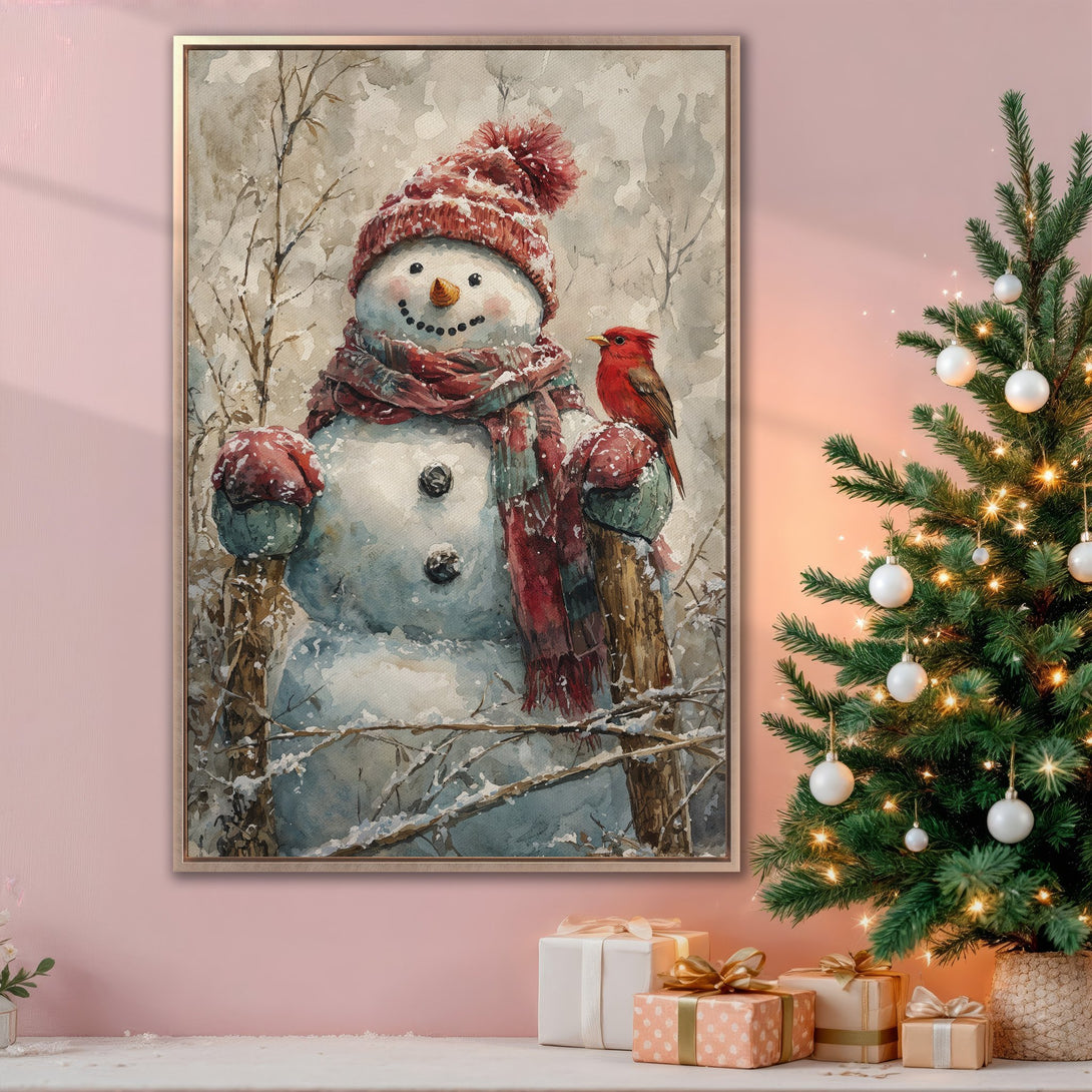 Framed Wall Art: Watercolor snowman with cardinal in a winter scene. Warm red and neutral color palette, perfect for holiday decor. Add cozy charm to your home!