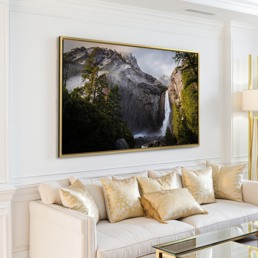 Canvas Print of a majestic waterfall scene in a modern interior. Features a natural color palette with greens, grays, and whites. Elevate your space!