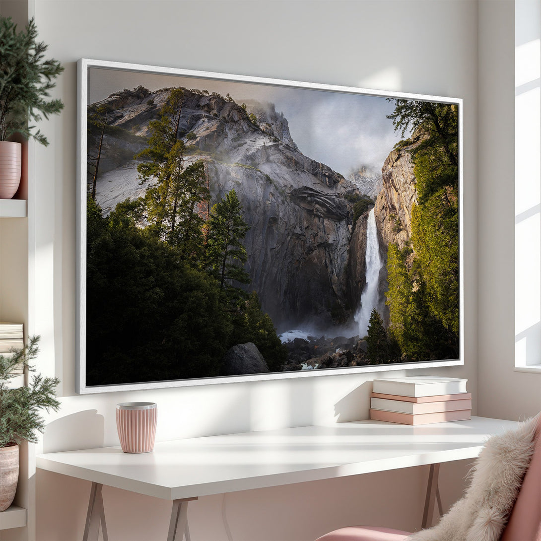 Framed Wall Art: Majestic waterfall canvas print in a serene interior. Features lush greens, rocky greys, and crisp whites. Elevate your space with nature's beauty!