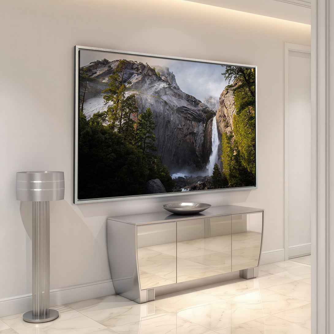 Framed Wall Art of a majestic waterfall landscape. Earthy tones of green, gray, and white create a serene and stylish interior design statement.