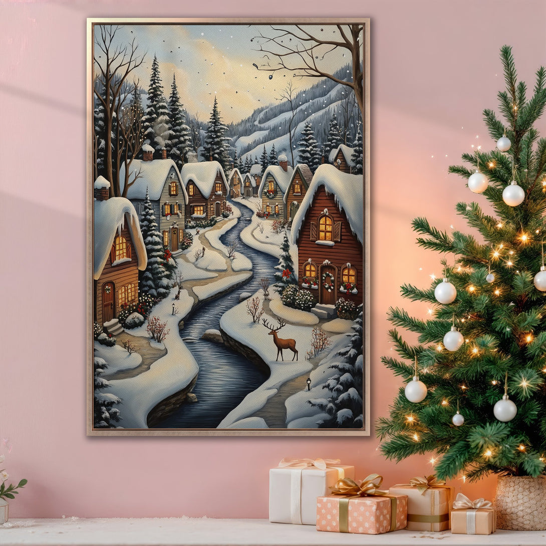 Framed Wall Art: Winter village scene canvas print with snow-covered houses, river, and deer. Warm, inviting color palette perfect for holiday decor.