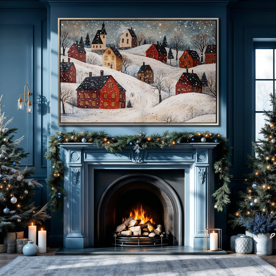 Framed Wall Art: Winter village scene canvas print in a cozy blue interior. Features red houses, snowy landscape, and warm color palette for holiday decor.