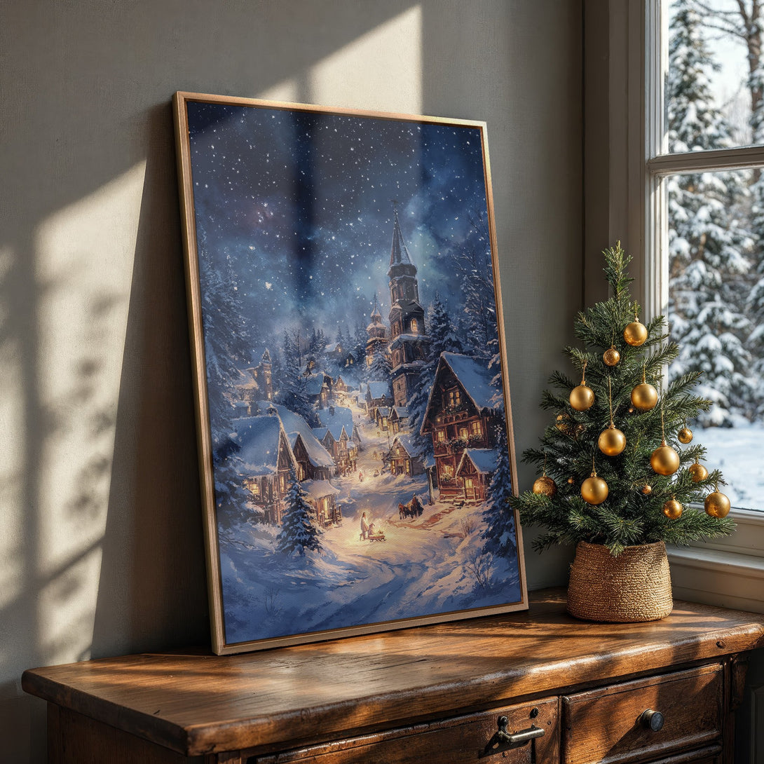 Framed Wall Art featuring a winter village scene with a blue and gold color palette, perfect for cozy holiday decor.