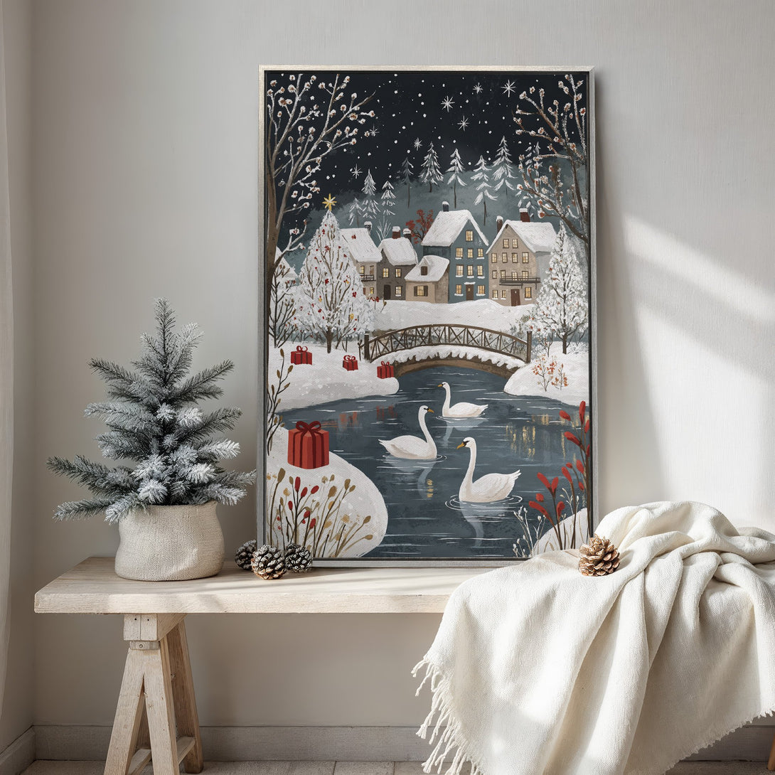 Framed Wall Art: Winter scene Canvas Print with swans, snowy village, and a serene blue and white color palette. Cozy holiday decor.