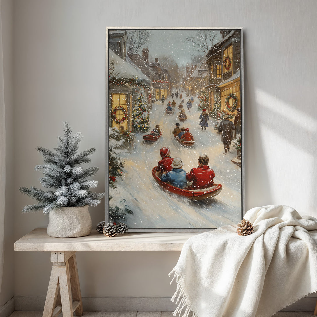Framed Wall Art: Winter scene Canvas Print with a snowy village, people sledding, and warm, inviting colors. Perfect for holiday decor!