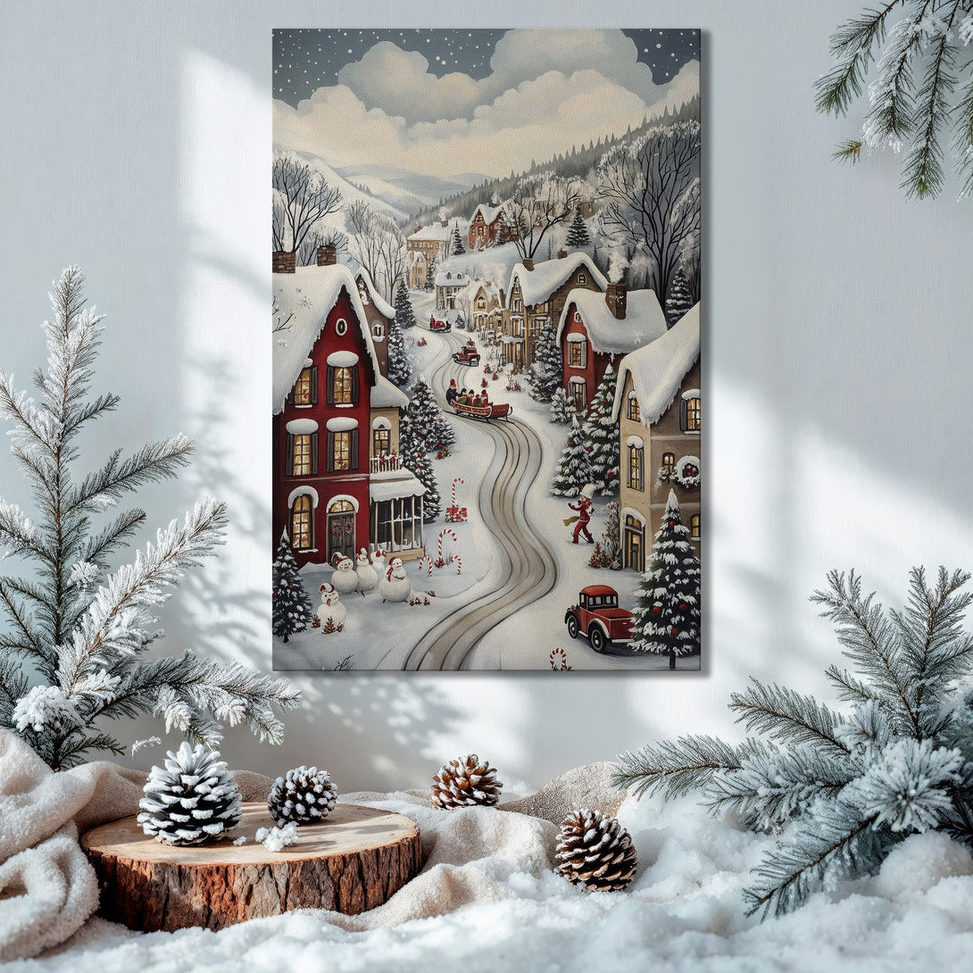 Framed Wall Art: Winter village scene in a cozy interior. Features a snowy landscape with red houses, soft blues, and warm gold accents. Perfect holiday decor!
