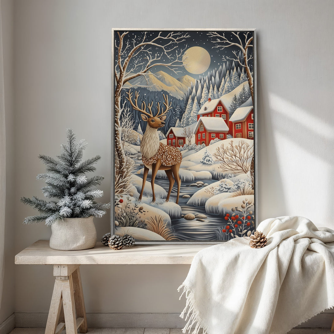 Framed Wall Art: Winter wonderland scene with deer, red houses, and snowy landscape. Beautiful blue, white, and red color palette. Perfect for cozy decor!
