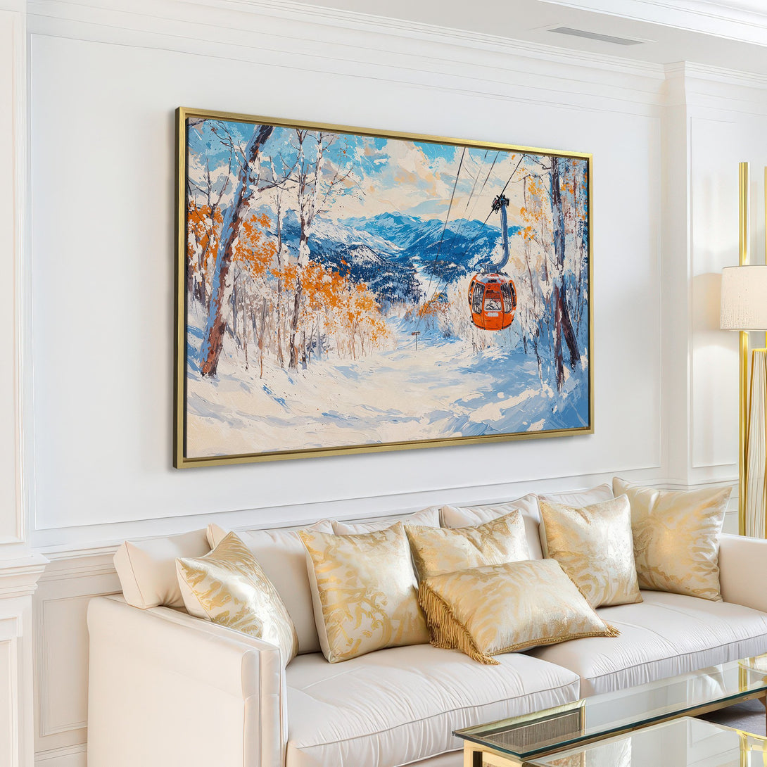 Canvas Print of a winter landscape with a ski lift, featuring a vibrant blue, orange, and white color palette, displayed in a modern living room.