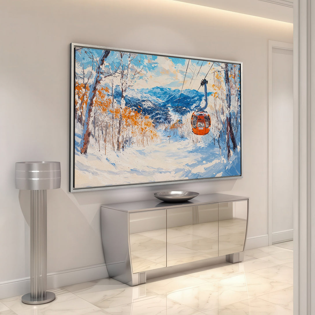 Framed Wall Art: Winter landscape Canvas Print with a ski lift, featuring a blue, orange, and white color palette. Perfect for adding a touch of nature to your home.