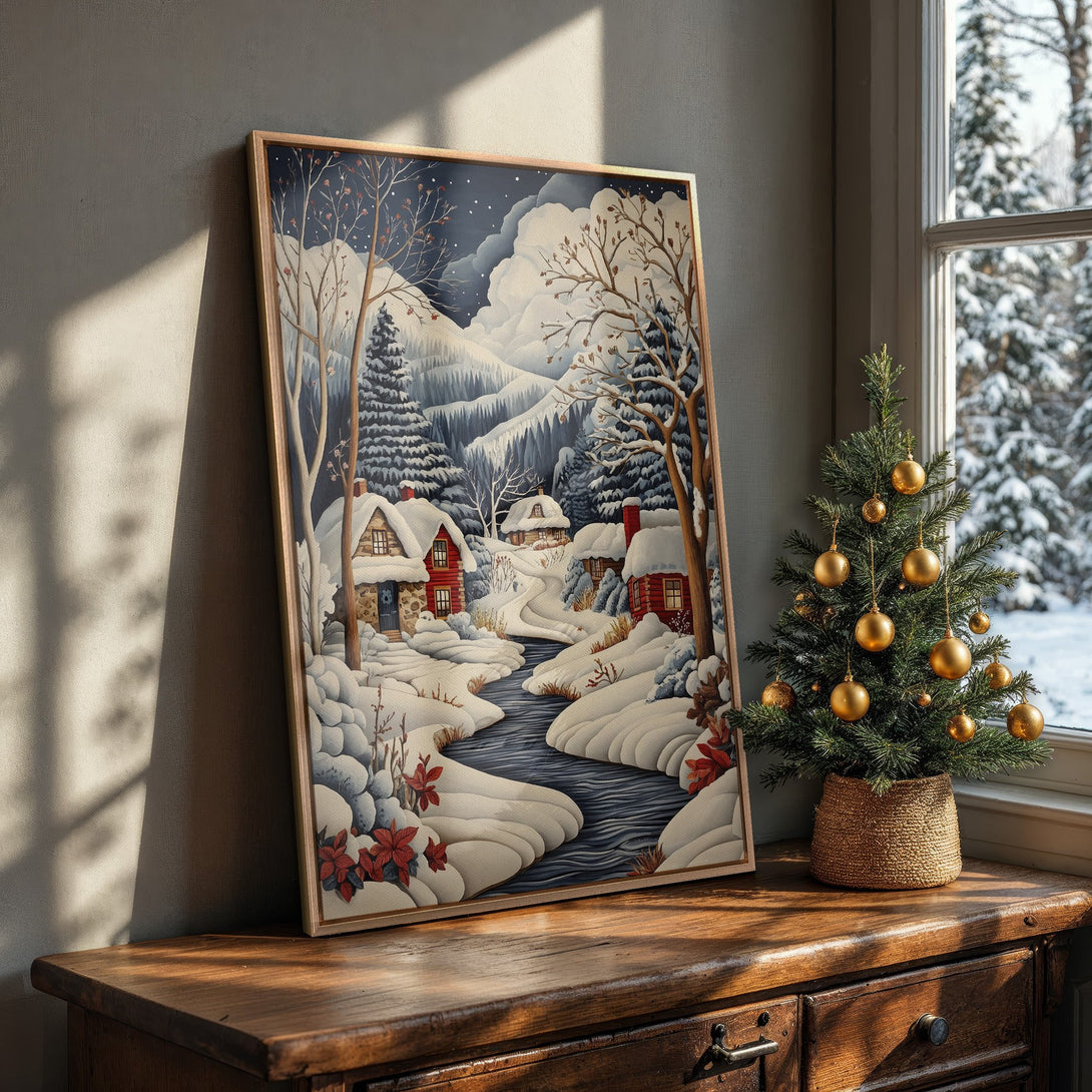Framed Wall Art: Winter landscape scene with snow-covered cabins, river, and trees. Cozy, inviting art in blue, white, and red tones. Perfect for holiday decor!