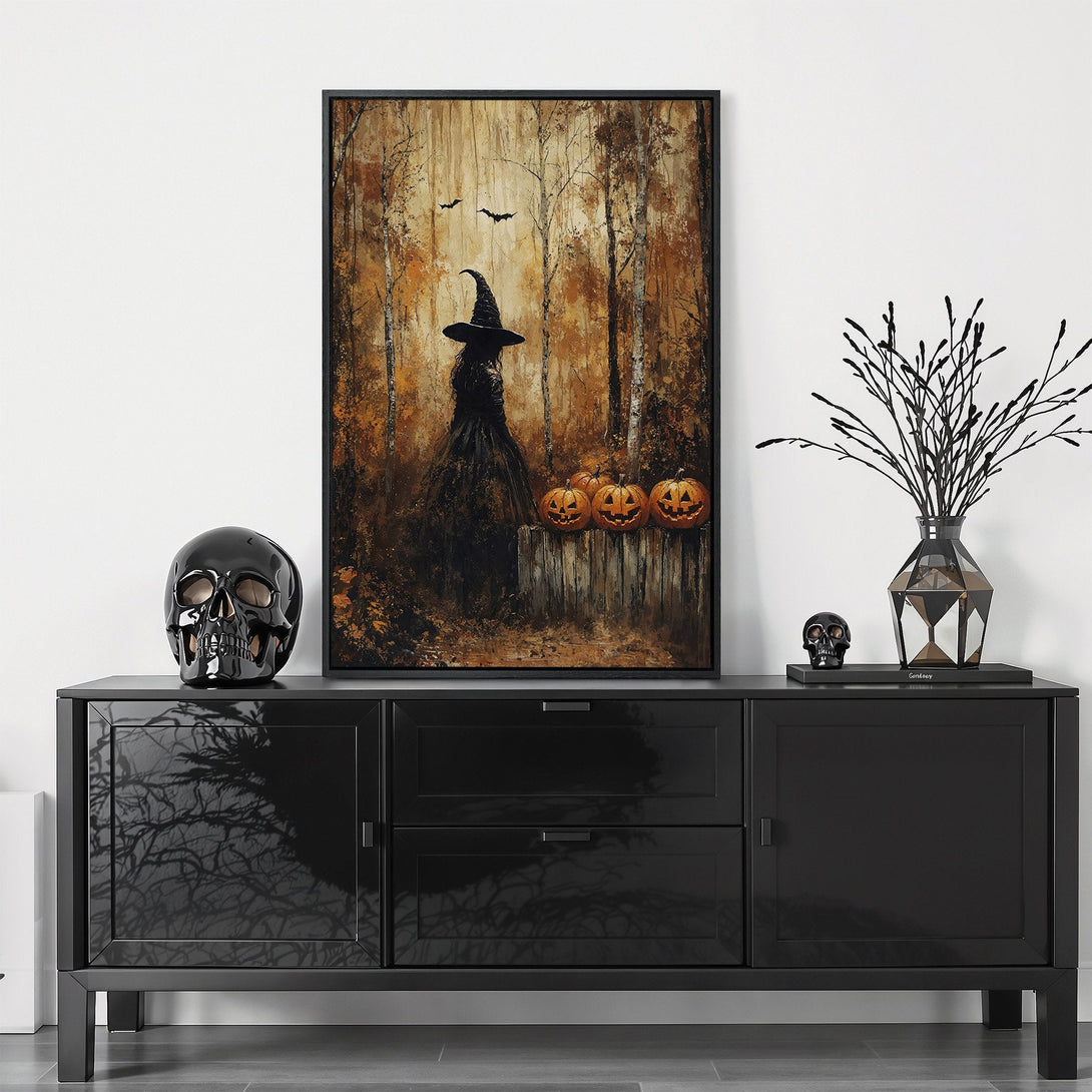 Framed Wall Art featuring a witch in a forest scene, perfect for Halloween decor. Warm, earthy tones create a spooky yet stylish aesthetic.