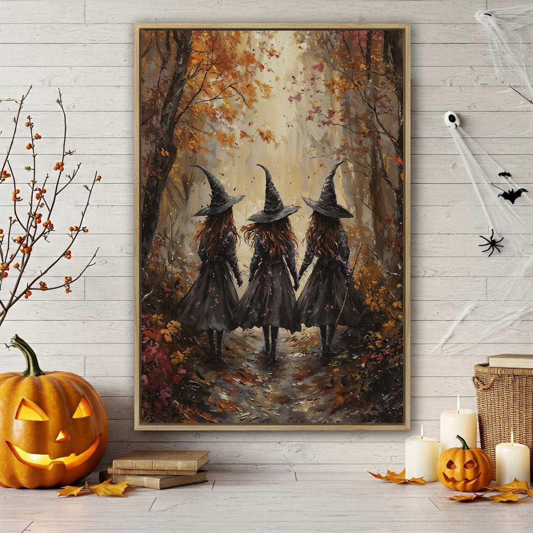 Framed Wall Art featuring three witches walking in a forest. Autumnal color palette with warm oranges and browns. Perfect Halloween decor.