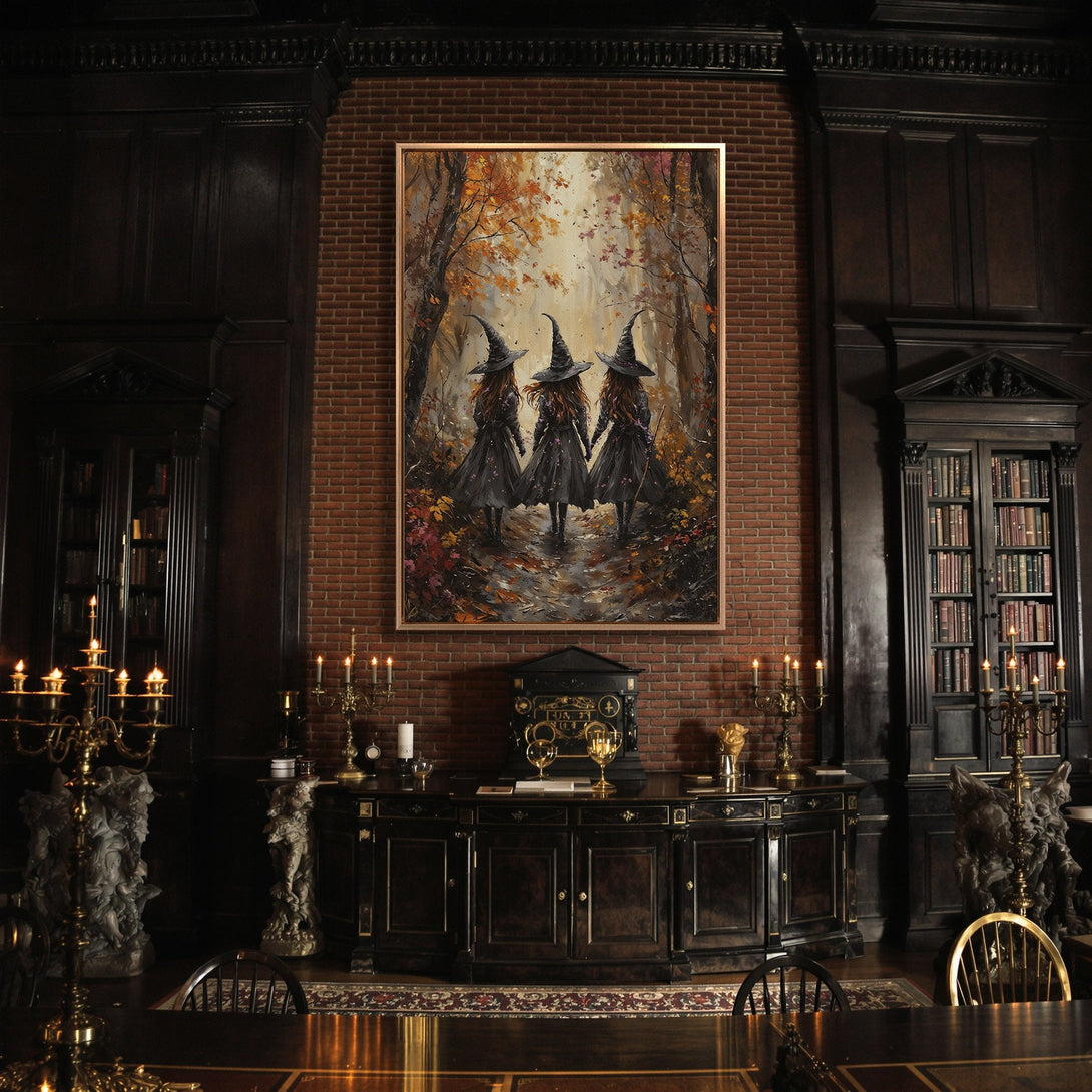 Framed Wall Art featuring three witches in a forest, autumnal colors. Perfect for Halloween decor! Add a touch of magic to your home.