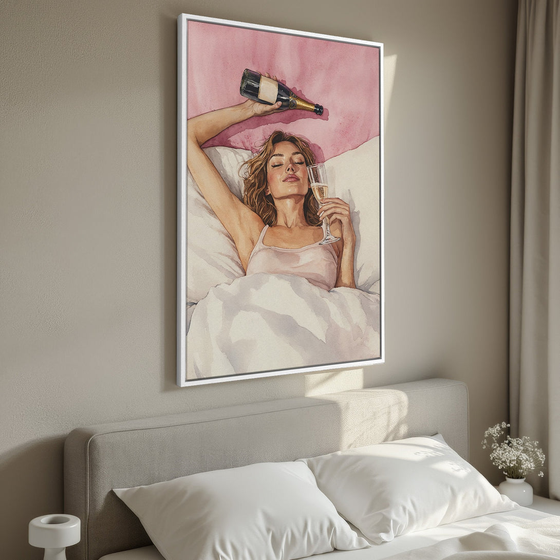 Framed Wall Art: Watercolor painting of woman in bed with champagne. Soft pink & neutral tones create a relaxing vibe. Perfect for bedroom decor.