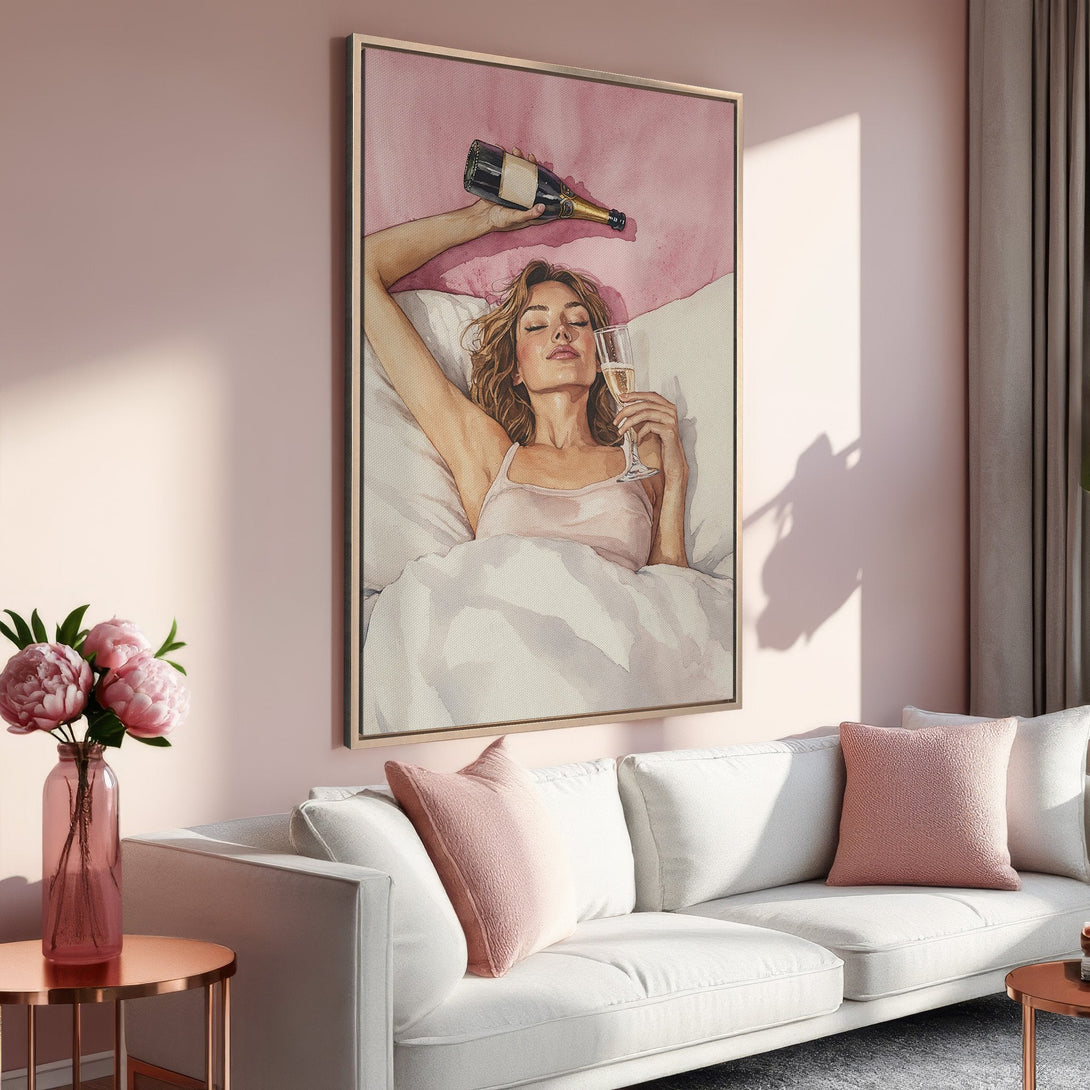 Framed Wall Art: Watercolor of woman with champagne, displayed in a pink & gold interior. Modern, elegant decor with a blush color palette.