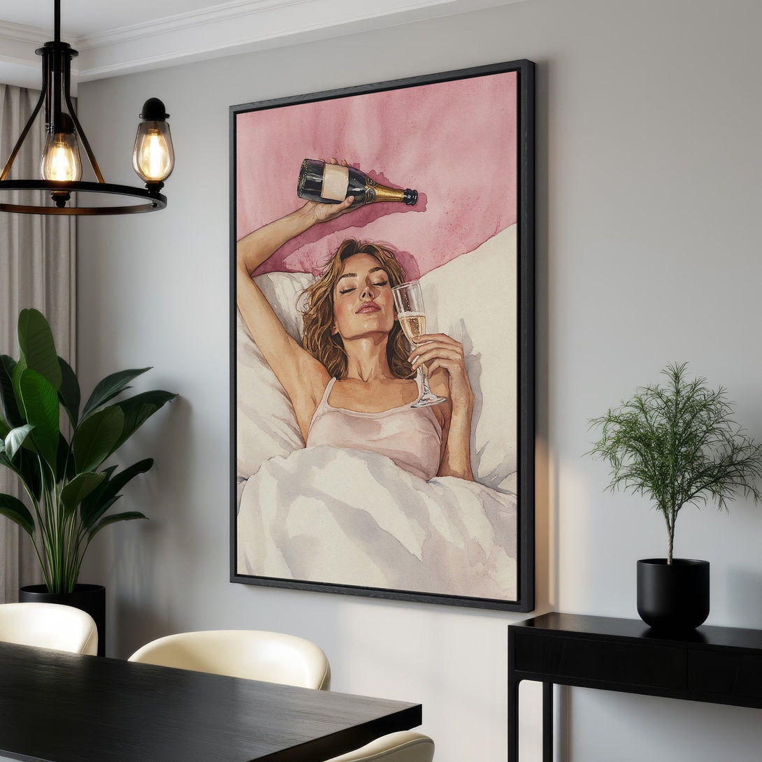 Framed Wall Art: Watercolor painting of woman with champagne in bed. Soft pink and neutral tones, elegant decor. Perfect for bedroom or living room.