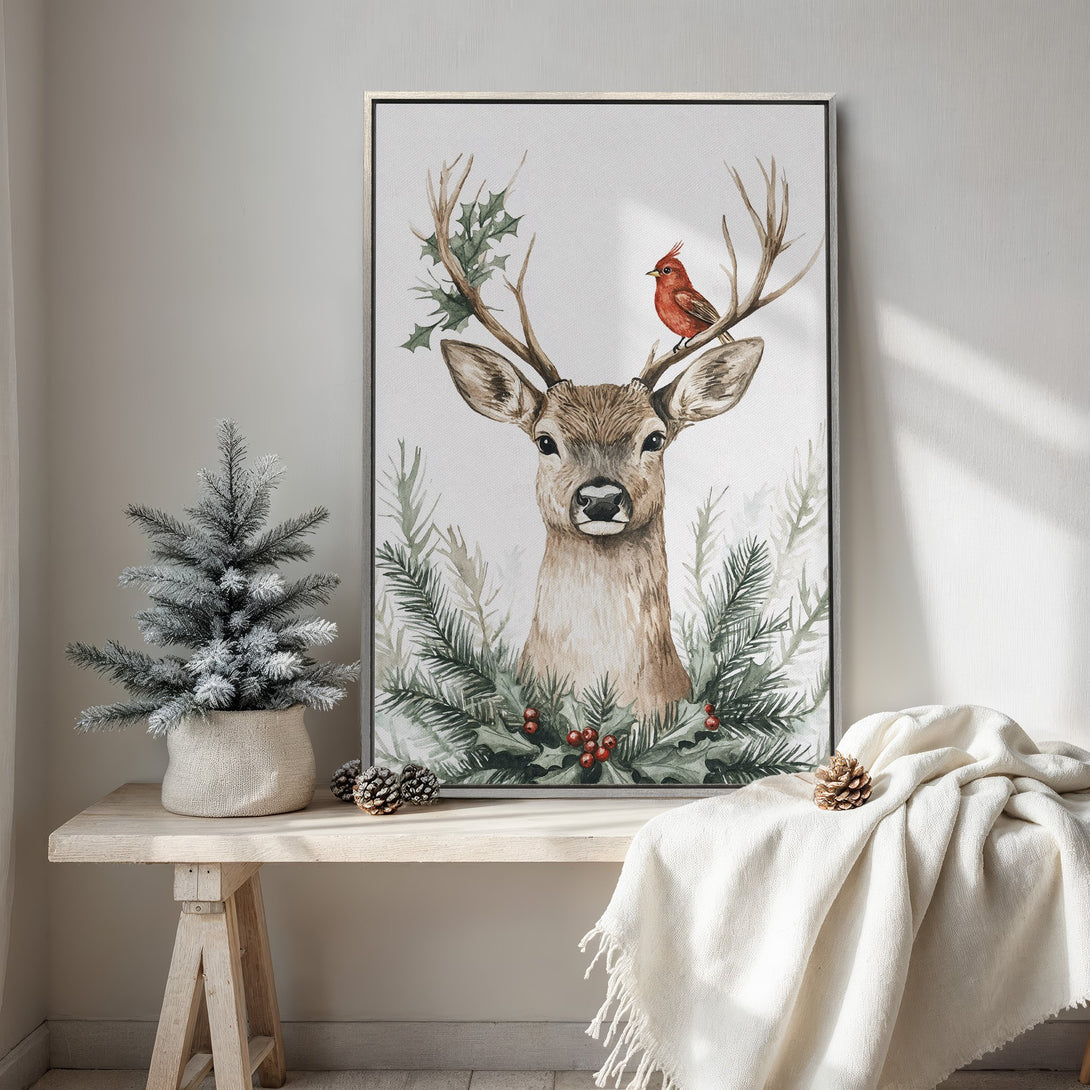 Framed Wall Art featuring a watercolor deer with a bird, surrounded by greenery. Rustic style with a neutral and green color palette, perfect for holiday decor.
