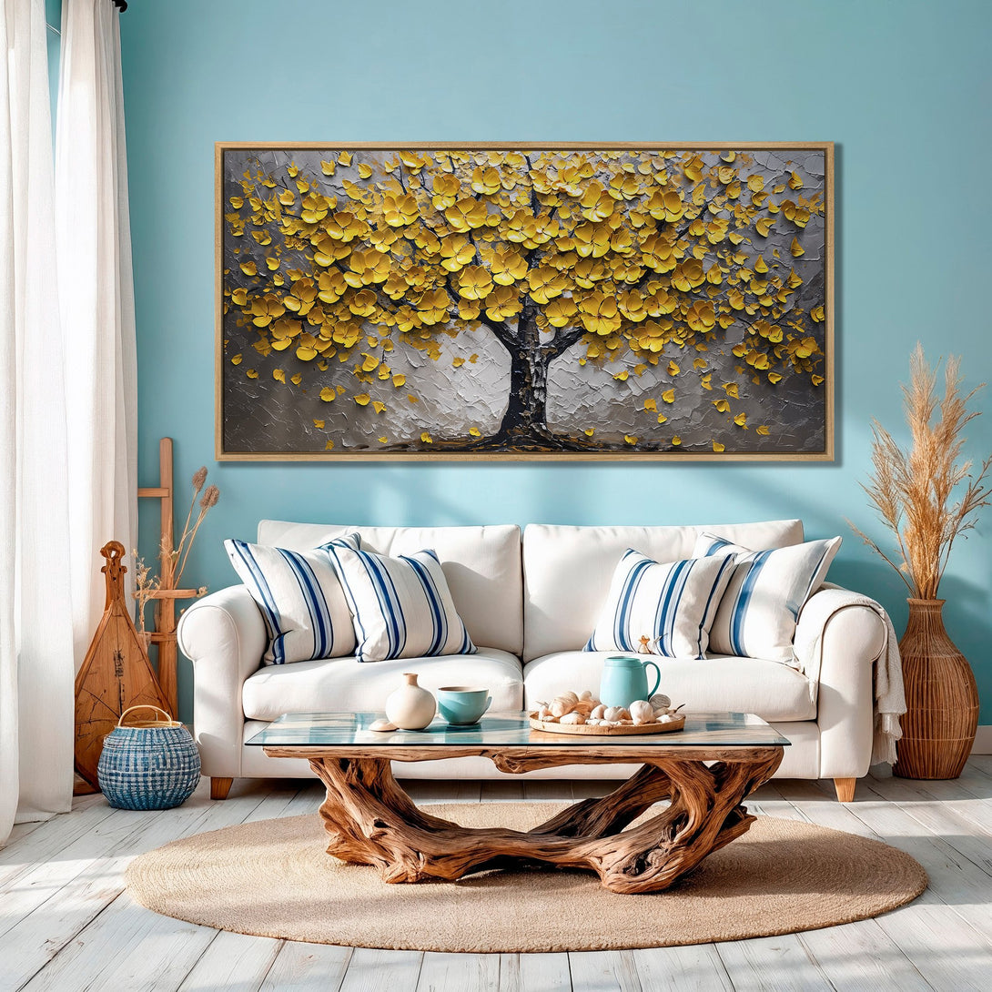 Framed Wall Art: Textured tree art with yellow flowers on a gray background. Modern decor in a room with blue walls and white furniture.