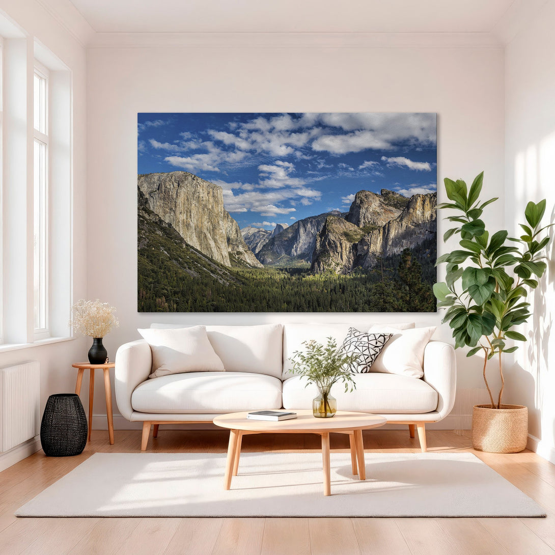 Framed Wall Art: Majestic Yosemite landscape canvas print with blue sky, green trees, and gold frame. Perfect for adding natural beauty to your home!