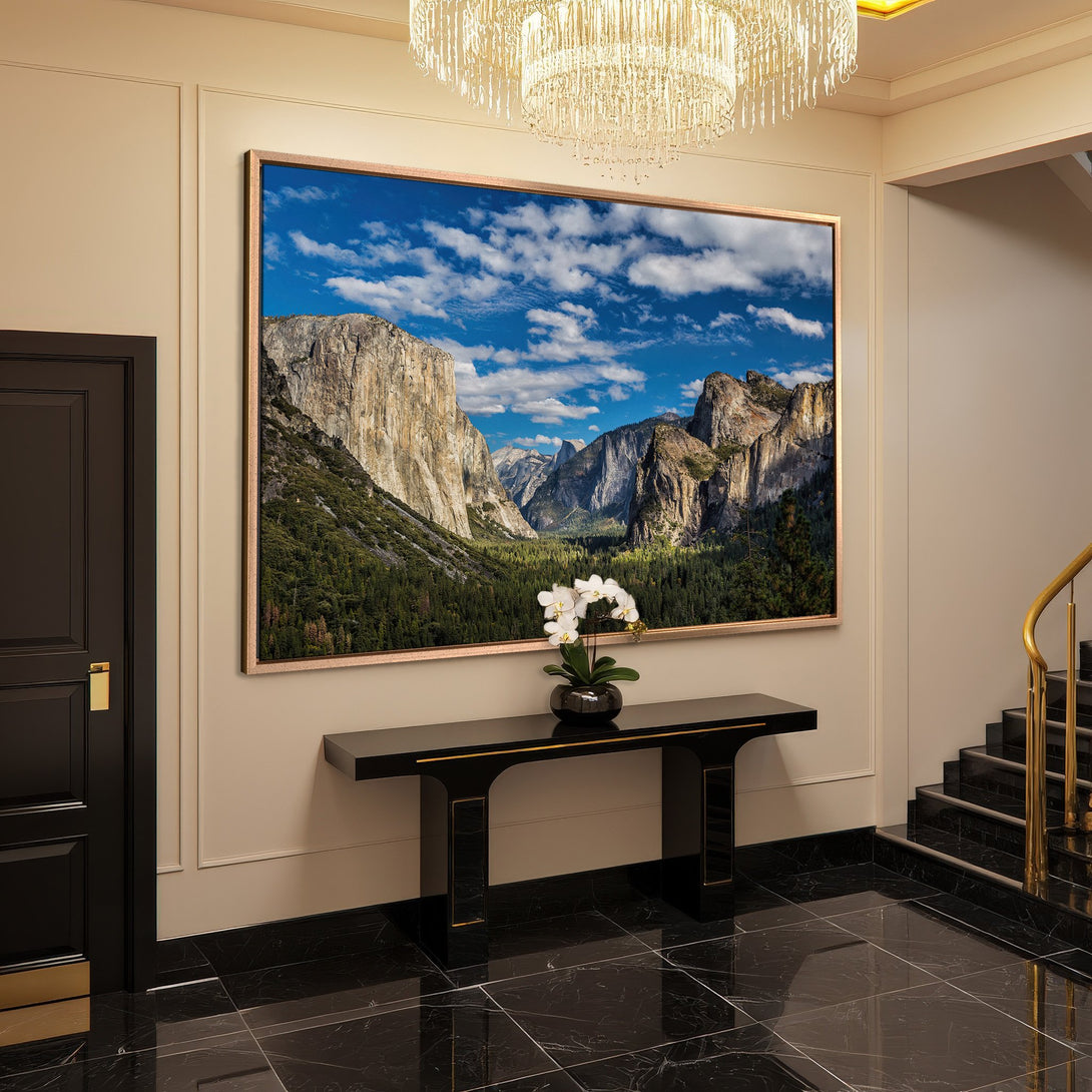 Framed Wall Art: Majestic mountain landscape canvas print with blue sky, green trees, and neutral tones. Elevate your space with nature's beauty!
