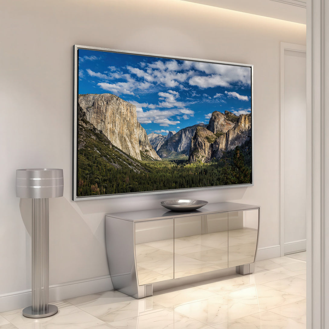 Framed Wall Art: Majestic landscape Canvas Print featuring mountains, blue sky, and green trees. Earthy tones create a calming and stylish interior aesthetic.