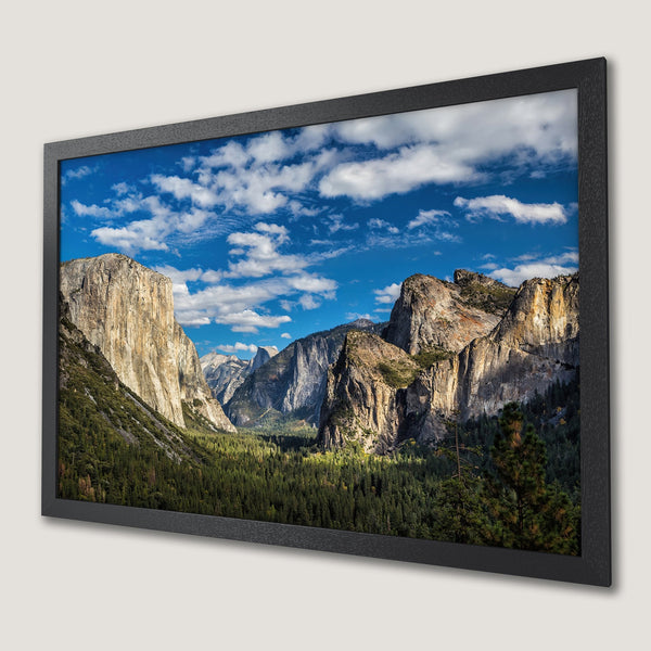 Framed Poster of Yosemite Valley landscape. Stunning nature photography with blue sky, green trees, and earthy tones. Perfect wall art!
