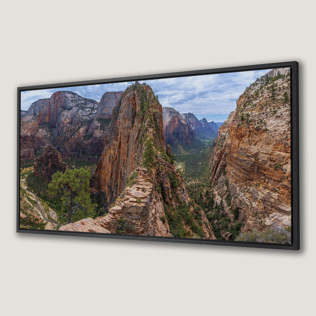 Framed Wall Art of a stunning canyon landscape. Earthy tones of orange, brown, and green create a natural, serene aesthetic. Perfect for adding a touch of nature to your home.