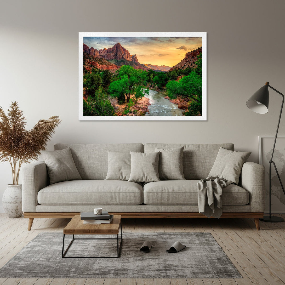 Framed Poster of a scenic landscape with mountains, river, and green trees. Warm color palette with orange, green, and brown tones. Add nature to your home!
